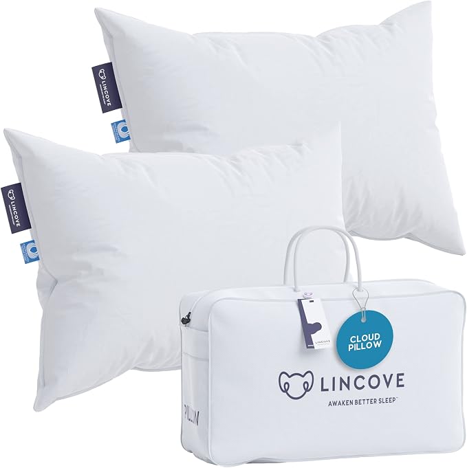 White pillows with a carry bag from the Lincove Cloud Natural Canadian Down Pillow set shown on a plain background.