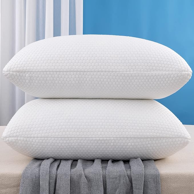 Two Molblly Standard Pillows stacked neatly on top of each other, showcasing their soft and comfortable design.