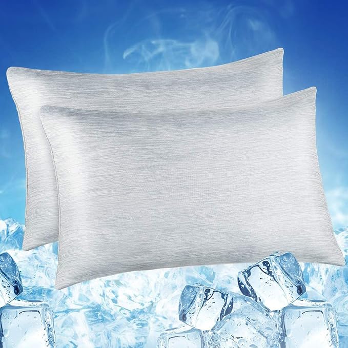 Two LUXEAR cooling pillows topped with ice, showcasing their cooling effect for a refreshing sleep experience.