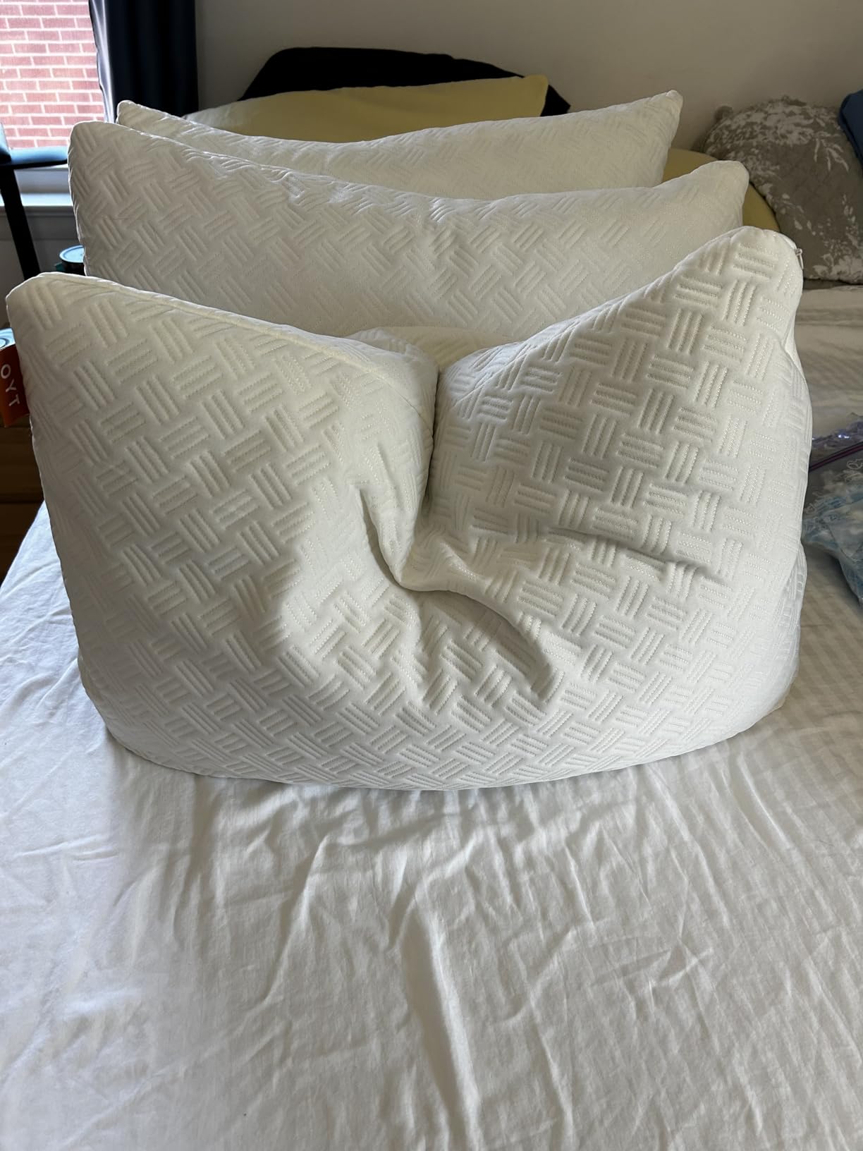 A bed with soft pillows and a pillowcase, showcasing OYT Cooling Bed Pillows in use for a product review.