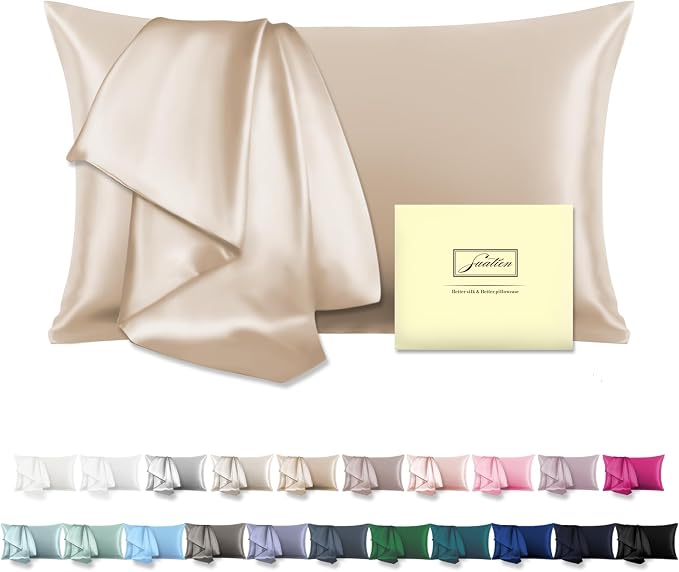 A soft pillow resting on smooth silk sheets, featuring a Natural Mulberry Silk Pillowcase for a luxurious touch.